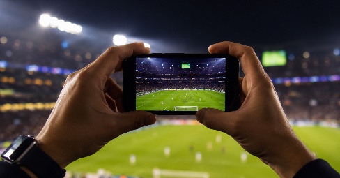 Fußballstadion bei Nacht mit hellem Flutlicht