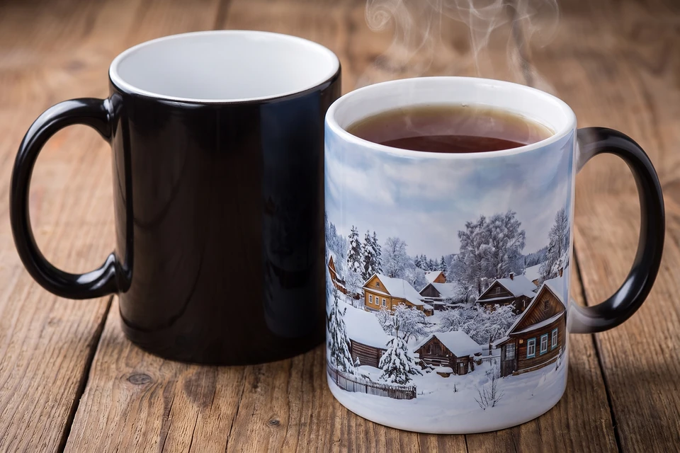 Zaubertasse schwarz und mit erschienenem Winterfoto